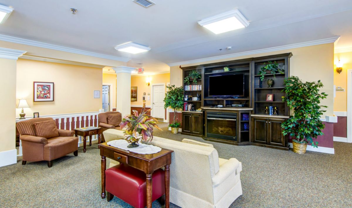 Interior view of Addington Place of Shoal Creek senior living room with modern decor and electronics.