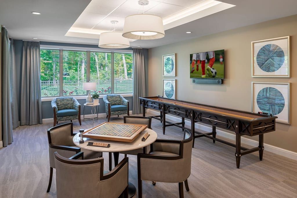 Senior living community, Blossom Springs, featuring elegant architecture, dining room decor, and lounge area.