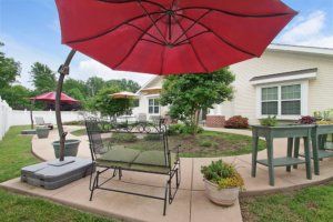 Seaton Chesterfield senior living community featuring lush yards, patio areas, and modern architecture.