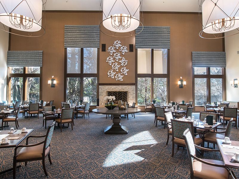 Interior view of The Terraces of Roseville senior living community featuring dining and reception areas.
