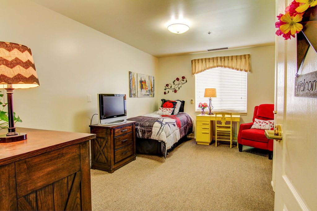 Senior living community room at Richmond Terrace with modern electronics, furniture, and decor.