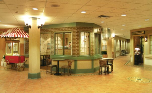 Interior view of Alden Des Plaines Rehab & Health Care's cafeteria with modern furniture and lighting.