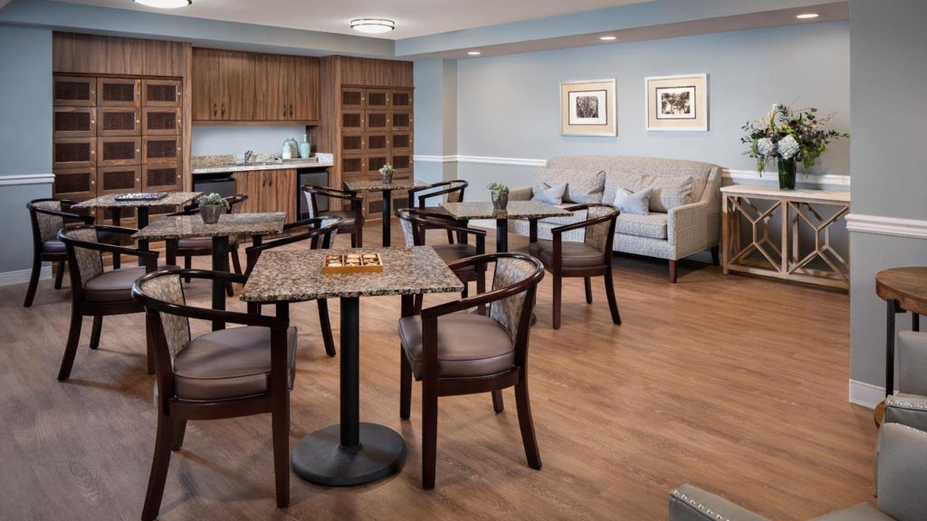 Interior view of Belmont Village Senior Living in Cardiff By The Sea featuring dining and living room decor.