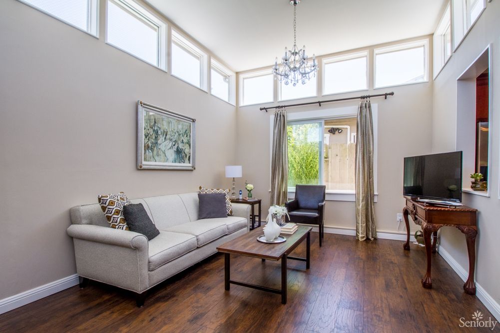Interior view of Pacific Care Home St. Cloud featuring elegant living room with modern decor.