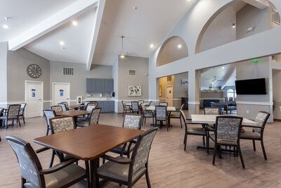 Interior view of the dining room with furniture and architecture at The Grove senior living community.