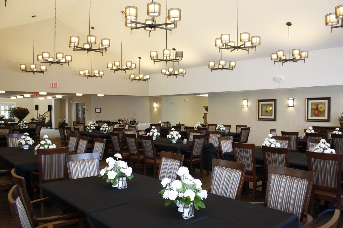Elegant dining room at St. Anthony of Lansing senior living community with lavish decor.