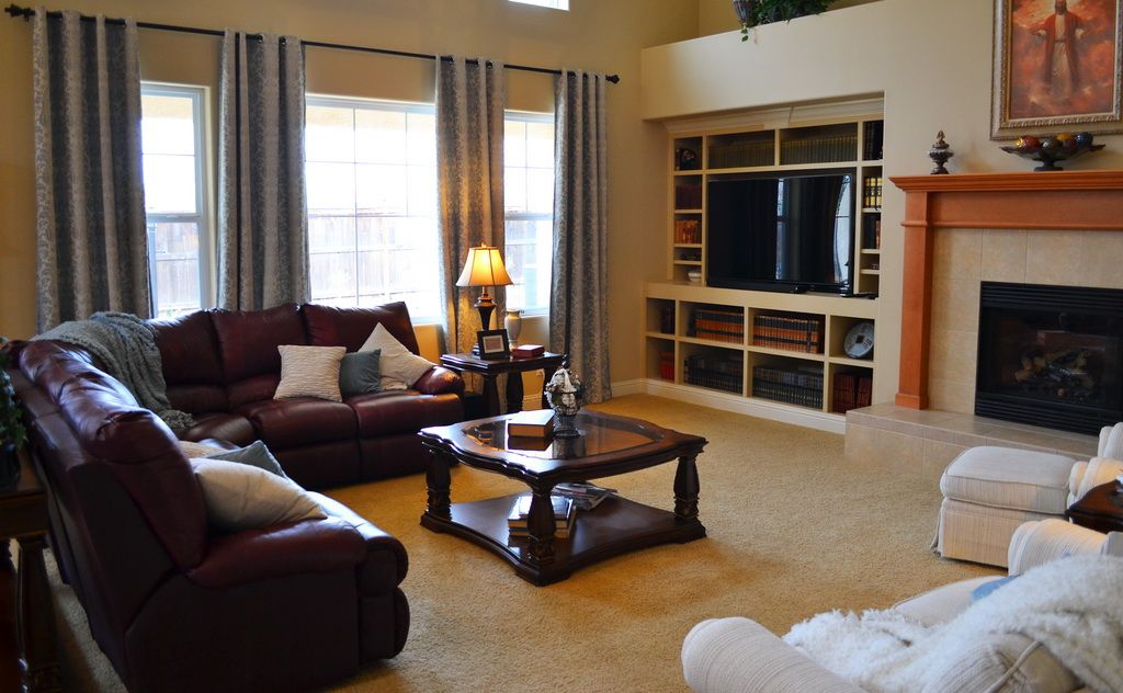 Senior living room interior at A Place Called Home Residential Care with modern decor and electronics.