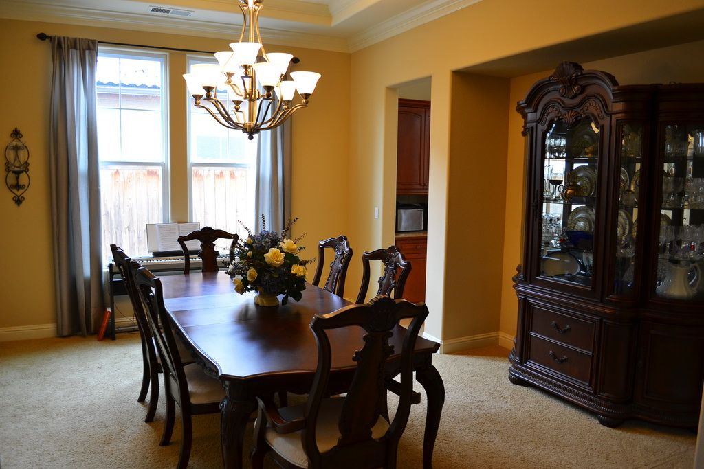Interior view of A Place Called Home Residential Care featuring dining room with elegant furniture and decor.