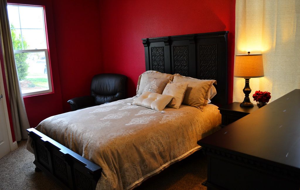 Interior view of a comfortable bedroom at A Place Called Home Residential Care, a senior living community.