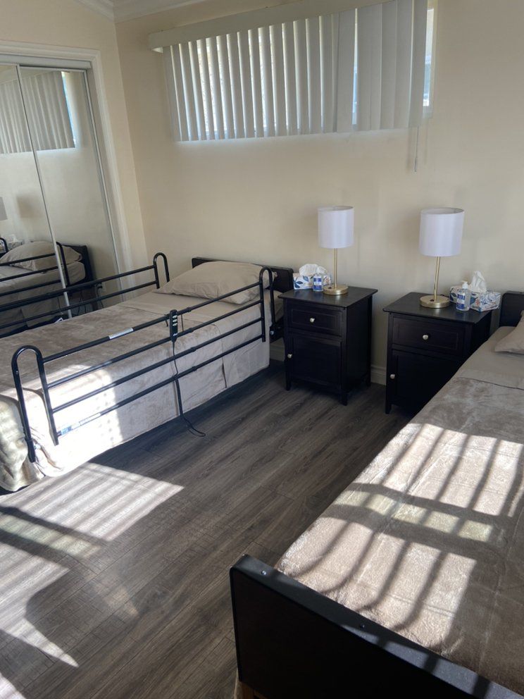 Bedroom interior at Noho Assisted Living, featuring modern furniture and home decor.
