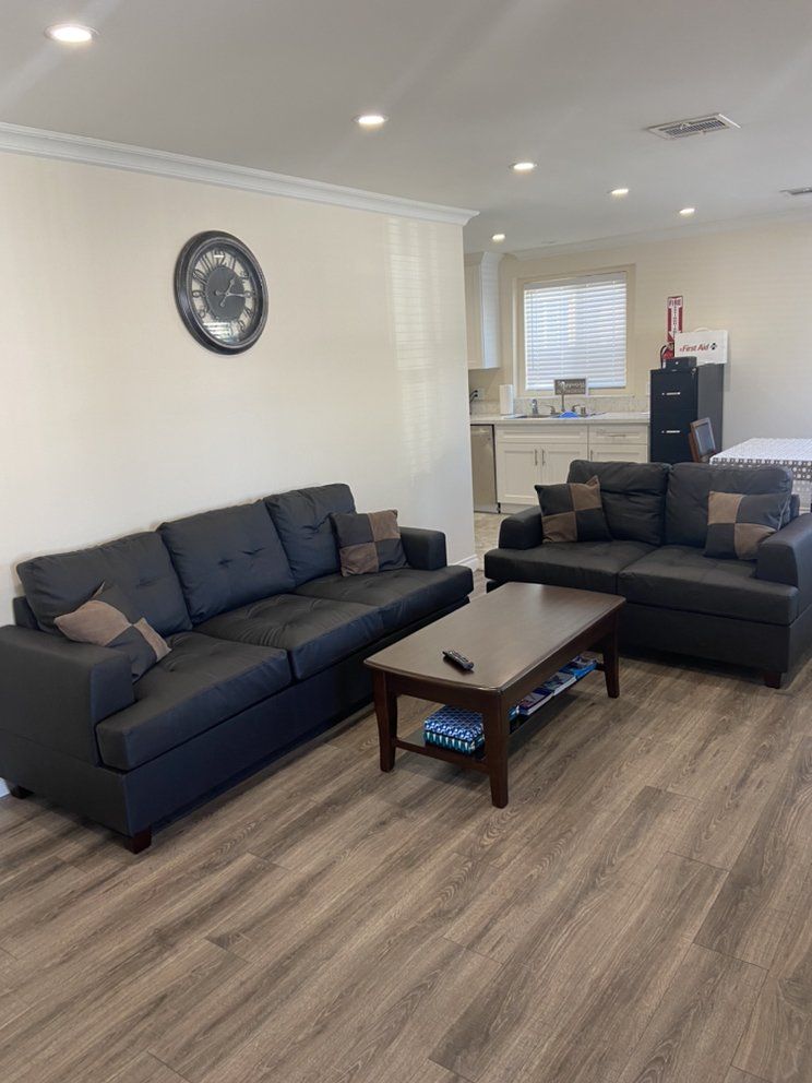 Senior living room at Noho Assisted Living with modern furniture and home decor.