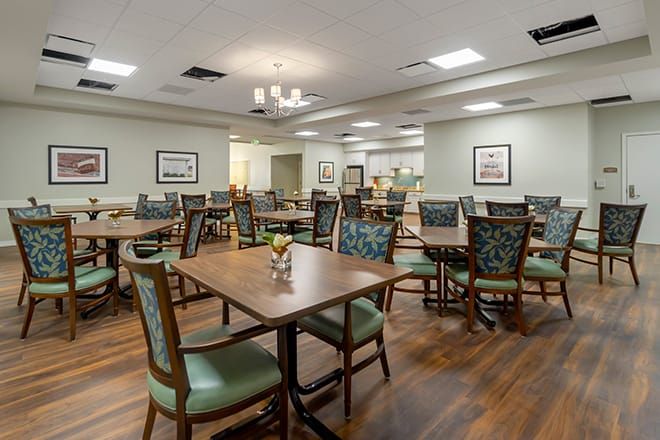 Interior view of Brookdale Jackson Oaks senior living community featuring dining area and art.