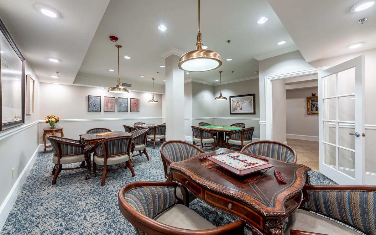 Senior living community Conservatory At Plano featuring elegant architecture and dining room decor.