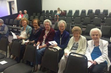 Seniors attending a seminar in the auditorium at Carrick Glen Senior Living community.
