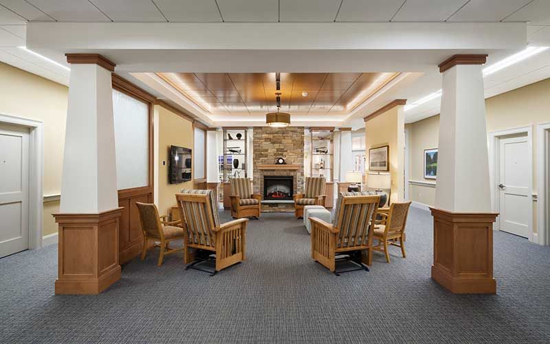 Interior view of Bridges® By Epoch At Trumbull senior living community featuring dining and living room.