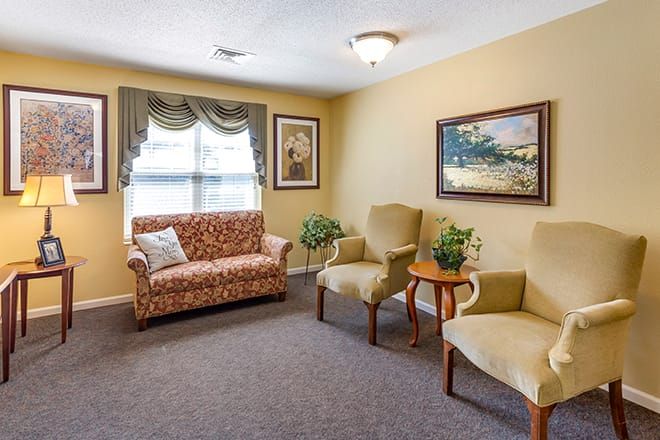 Senior living community Brookdale Valparaiso's reception room with cozy furniture and art decor.