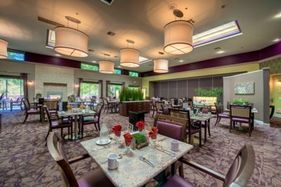 Interior view of Regency Grand of West Covina's dining area with elegant furniture and chandeliers.