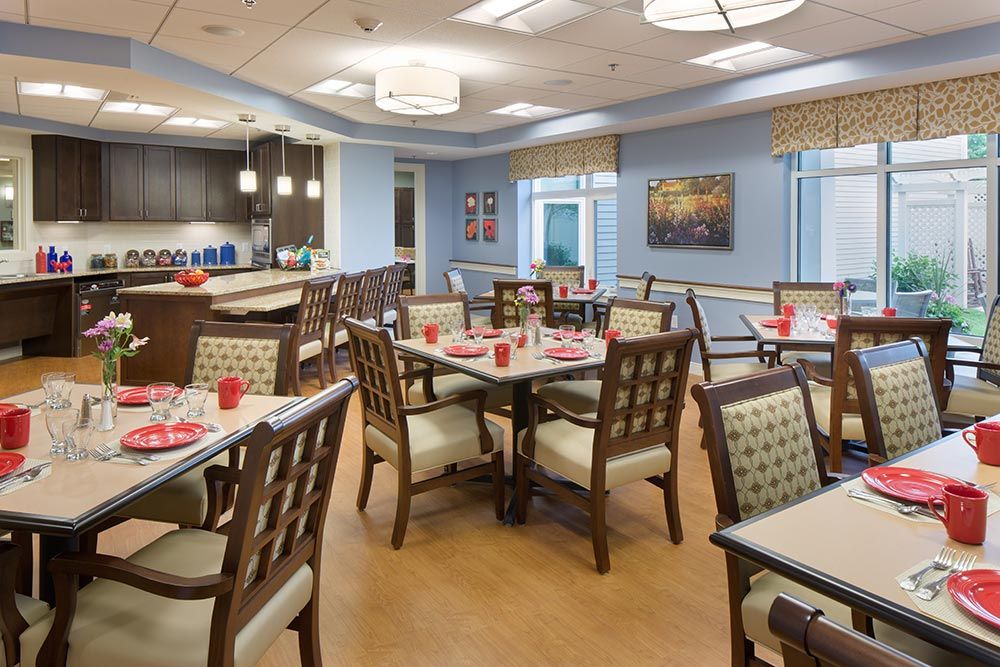 Interior view of Benchmark Senior Living On Clapboardtree featuring dining area and art.