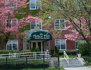 Senior living community in Arbor Hill with urban architecture, lush gardens, and nature paths.