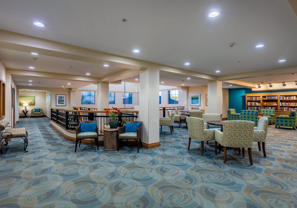 Interior view of Fairwinds Ivey Ranch senior living community featuring modern architecture and furniture.