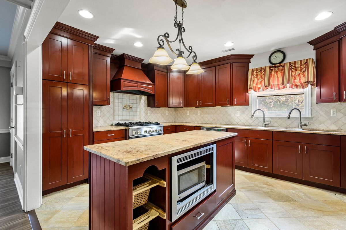 Interior view of Fox Trail Memory Care at Paramus featuring a well-designed kitchen with modern appliances.