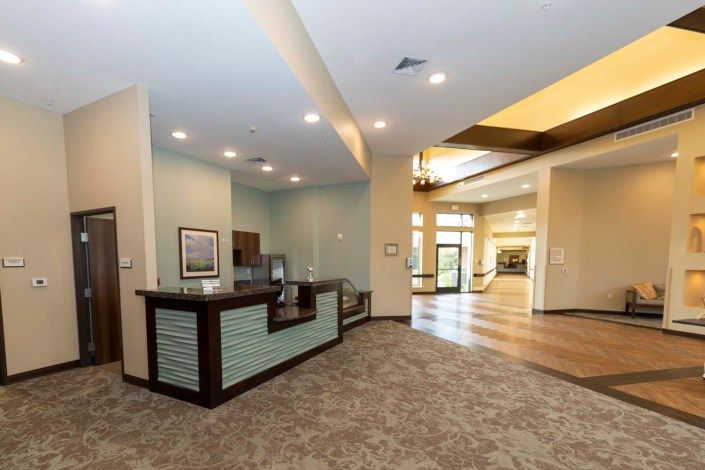 Architectural view of Sedona Trace Health & Wellness senior living community foyer with art decor.