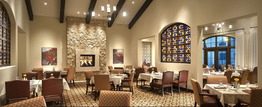 Interior view of Maravilla Scottsdale senior living community featuring dining room with art.