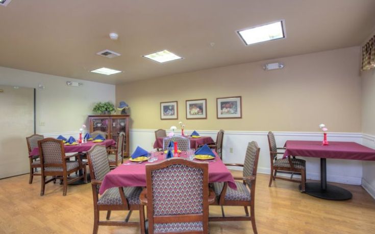 Interior view of Summerfield Memory Care of Encinitas featuring dining room with art decor.