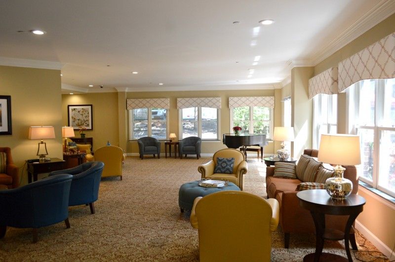 Senior living community interior at Bethesda Gardens Kirkwood, featuring elegant decor and a grand piano.
