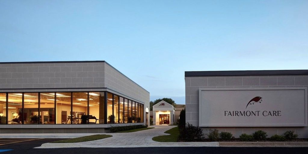 Fairmont Care senior living community featuring modern architecture, transportation facilities, and indoor amenities.