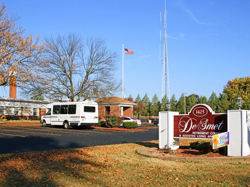 Caravan van at DeSmet Retirement Community providing transportation services for seniors.