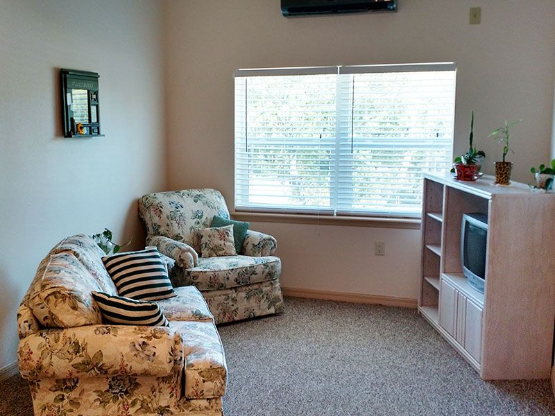 Interior view of Angels Senior Living At New Tampa featuring modern decor, electronics, and furniture.