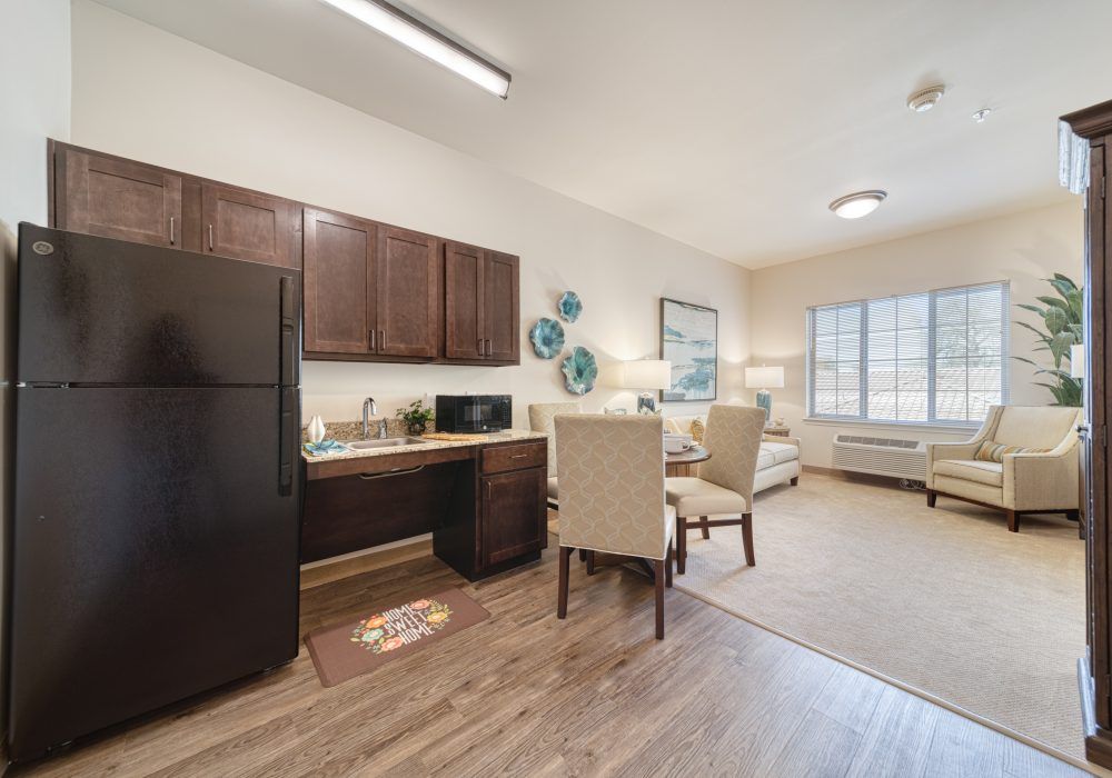 Interior view of Home Decor senior living community featuring a cozy kitchen and living room.