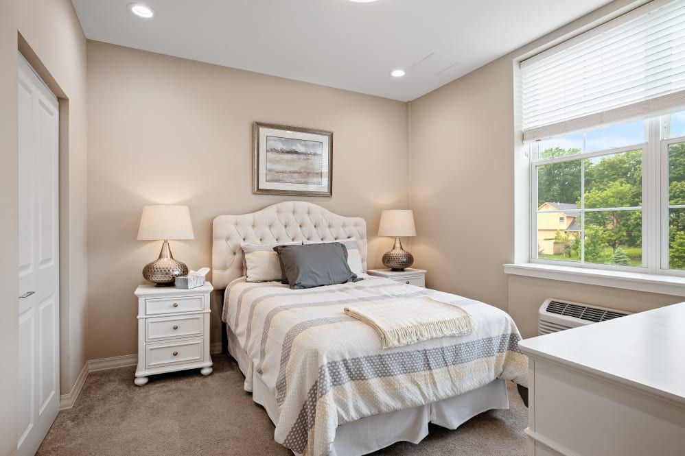 Corner view of a well-decorated bedroom in Anthology of Overland Park senior living community.