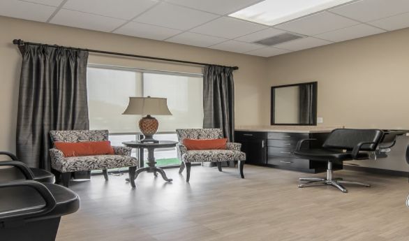 Senior living community interior at Simpson Place featuring elegant furniture and a beauty salon.