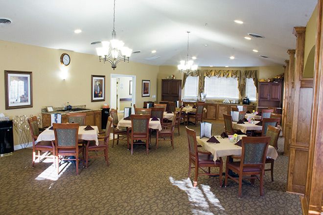Interior view of Brookdale Round Rock senior living community featuring dining area and reception room.