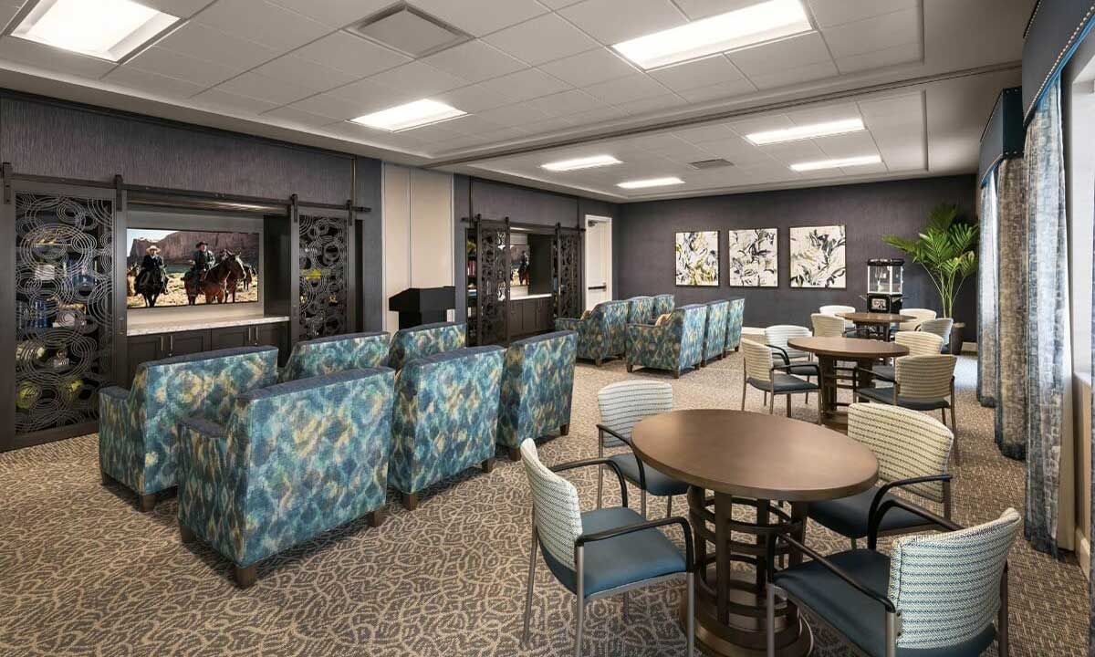 Senior living community HarborChase of Wellington Crossing featuring dining area, lounge, and horse decor.