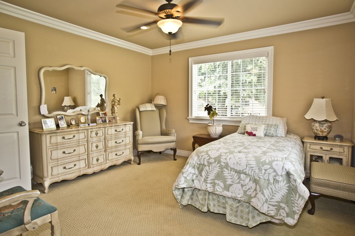 Senior living community Granite Bay Villas II featuring furnished bedrooms with modern appliances and decor.
