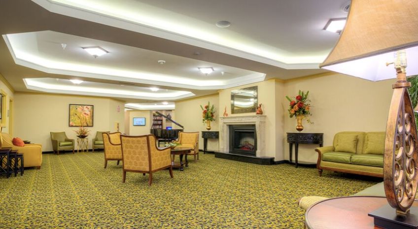 Interior view of Pomeroy Living Sterling senior community featuring reception room decor.