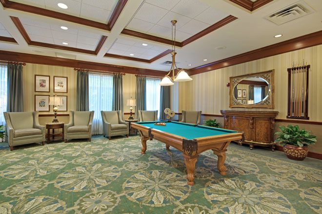 Interior view of Brookdale Creve Coeur senior living community featuring a billiard room with decor.