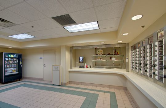 Interior view of Senior Suites Bridgeport featuring modern appliances, furniture, and electronics.