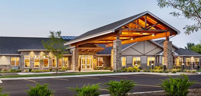 Silverado St. Charles senior living community featuring suburban architecture and outdoor portico.