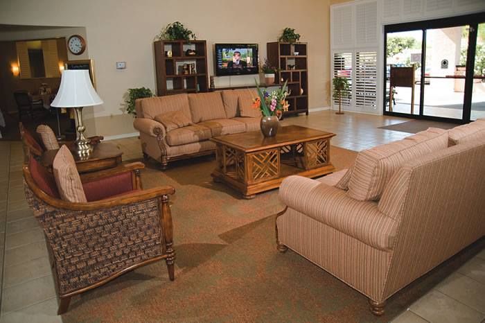 Senior living room interior at The Springs of Scottsdale featuring cozy furniture and modern decor.
