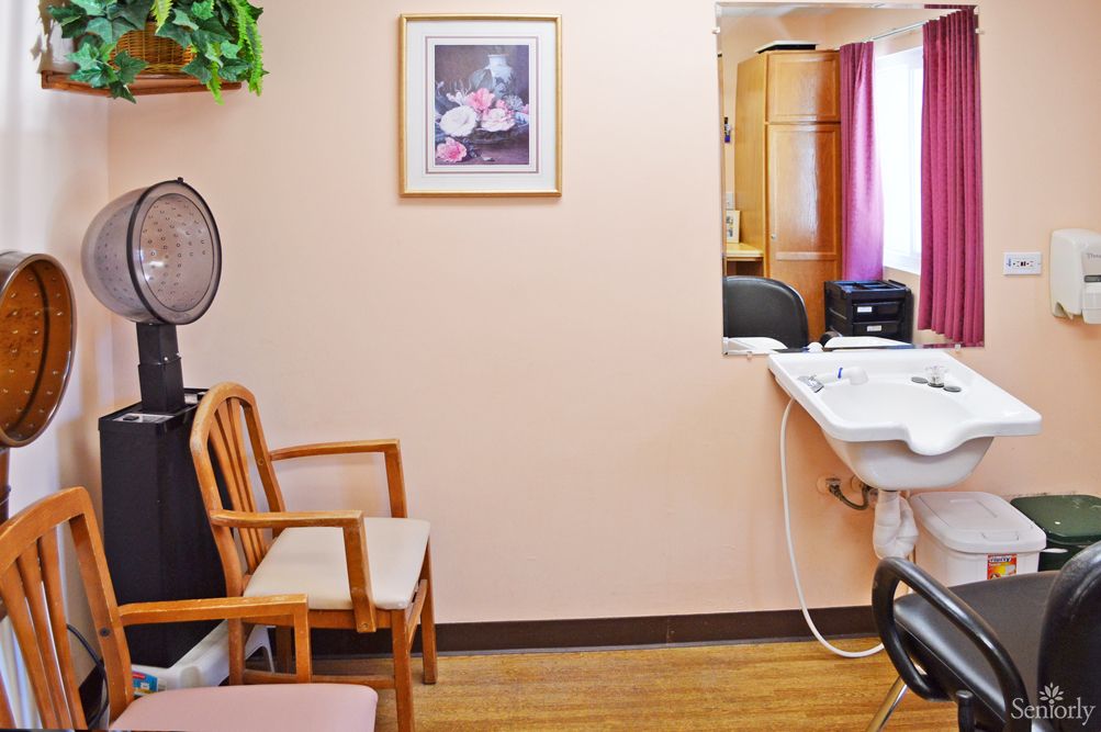 Interior view of Primrose Alzheimer's Living community with hardwood floors and furniture.