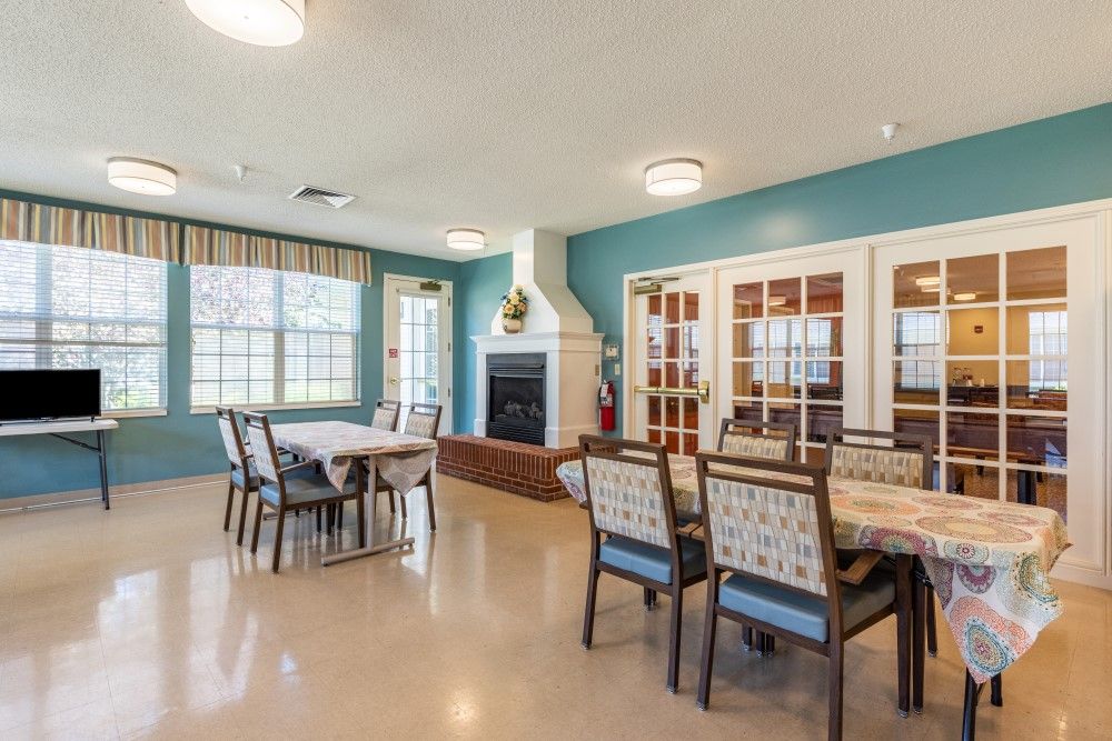 Interior view of American House Johnson City senior living community featuring dining and living areas.