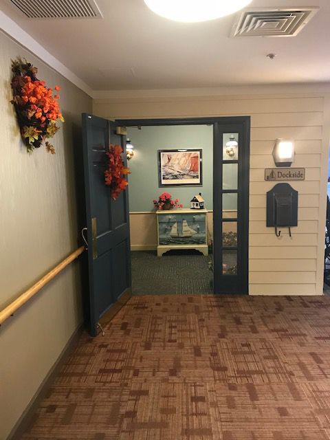 Interior view of Arden Courts Of Silver Spring senior living community with floral decor.