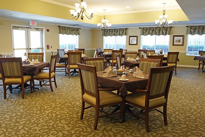 Interior view of Brookdale Emerson senior living community featuring dining area and reception room.