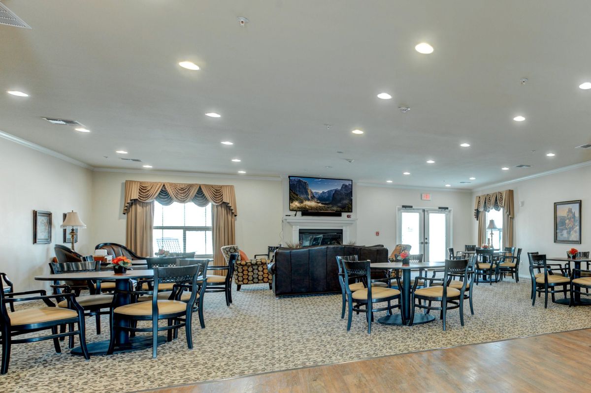 Interior view of Arabella of Athens senior living community featuring dining area, lounge, and decor.
