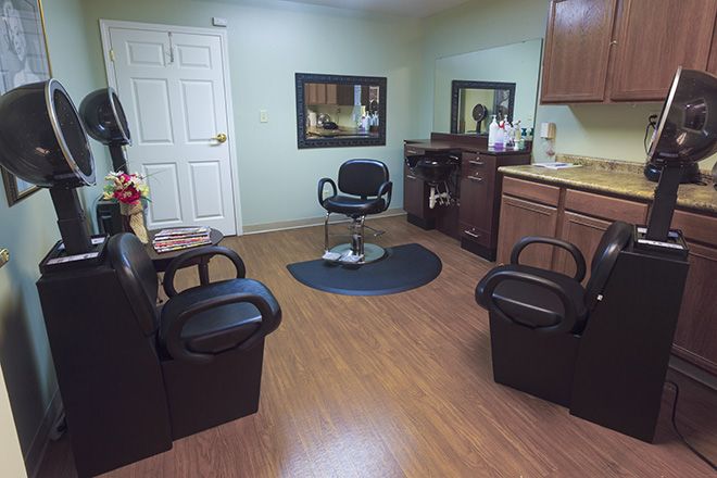 Senior living community Brookdale Johnson City featuring a beauty salon with modern electronics and indoor plants.