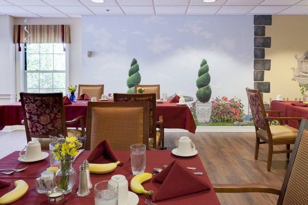 Senior living community dining room at Brighton Gardens of Tuckerman Lane with elegant decor.